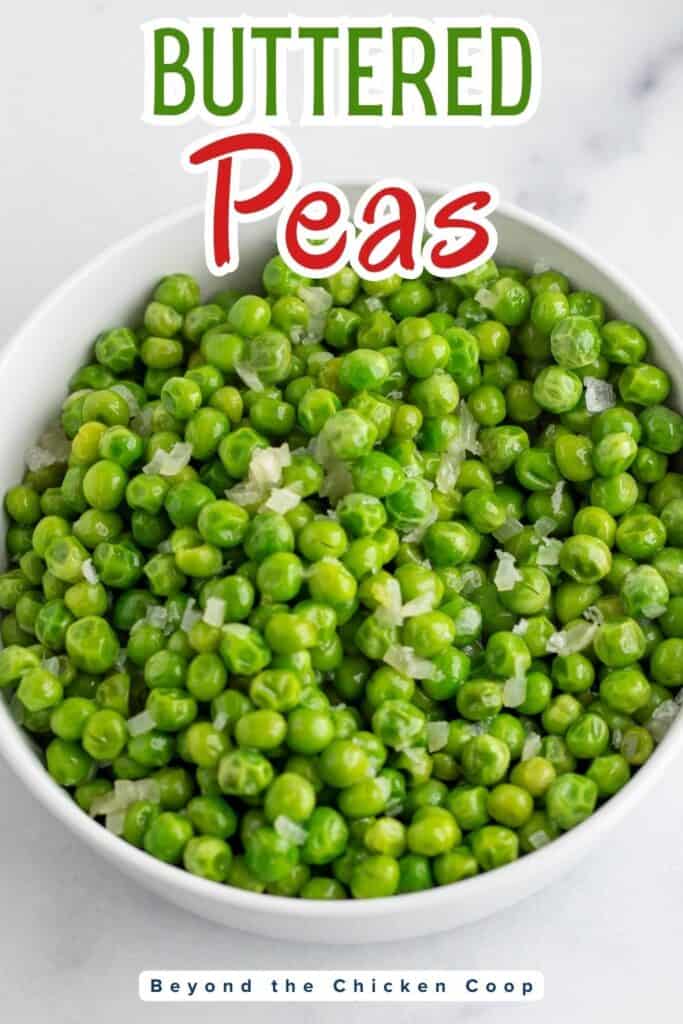 A bowl filled with peas and finely chopped shallots.