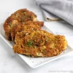 Crispy Chicken Cutlets on a white platter.