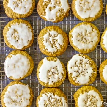 Iced Oatmeal Cookies on a baking rack.