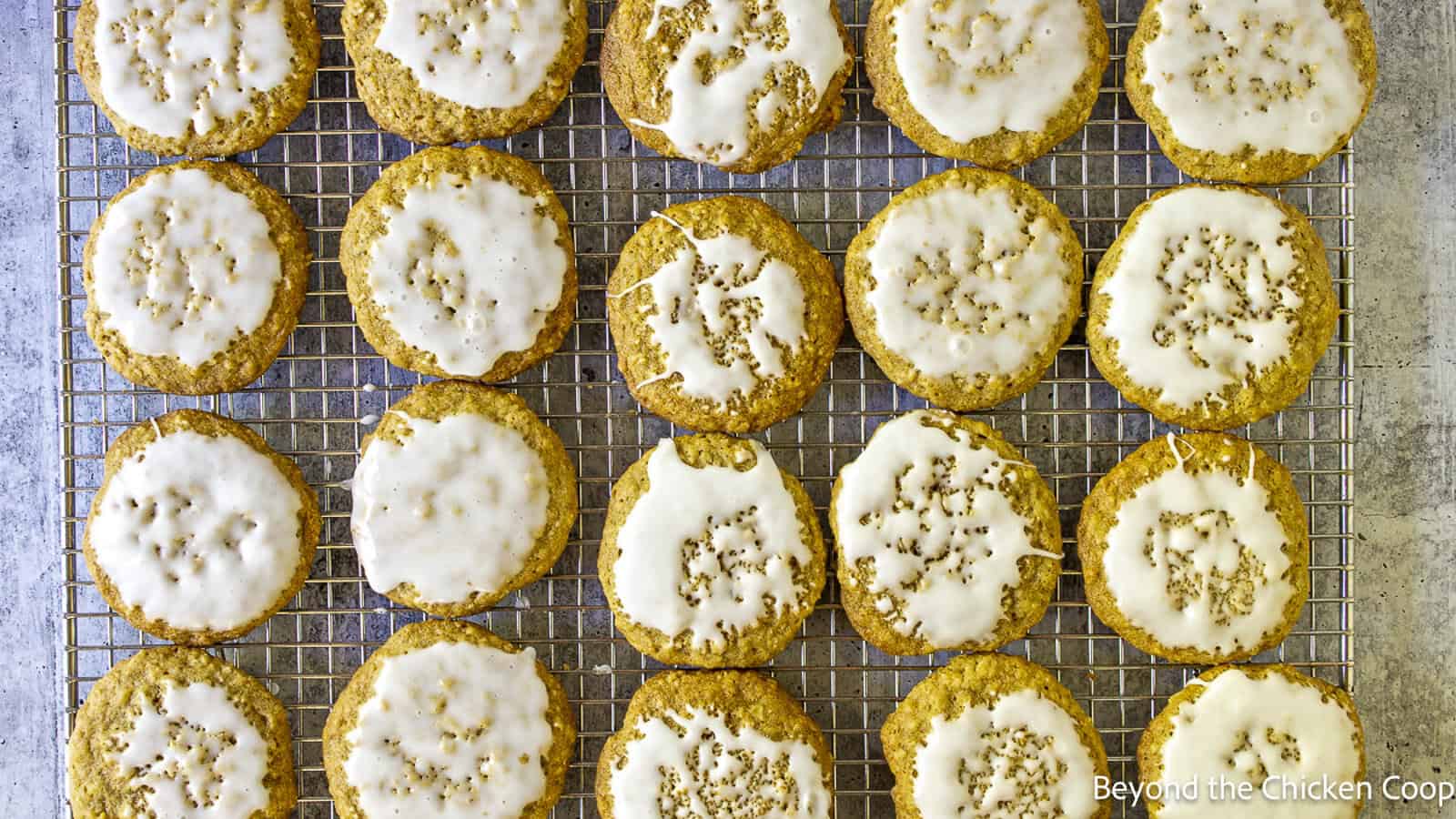 Iced Oatmeal Cookies on a baking rack.