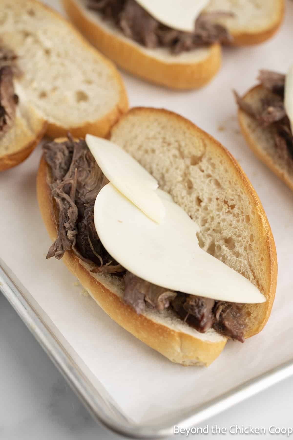 Sliced cheese on a sandwich.