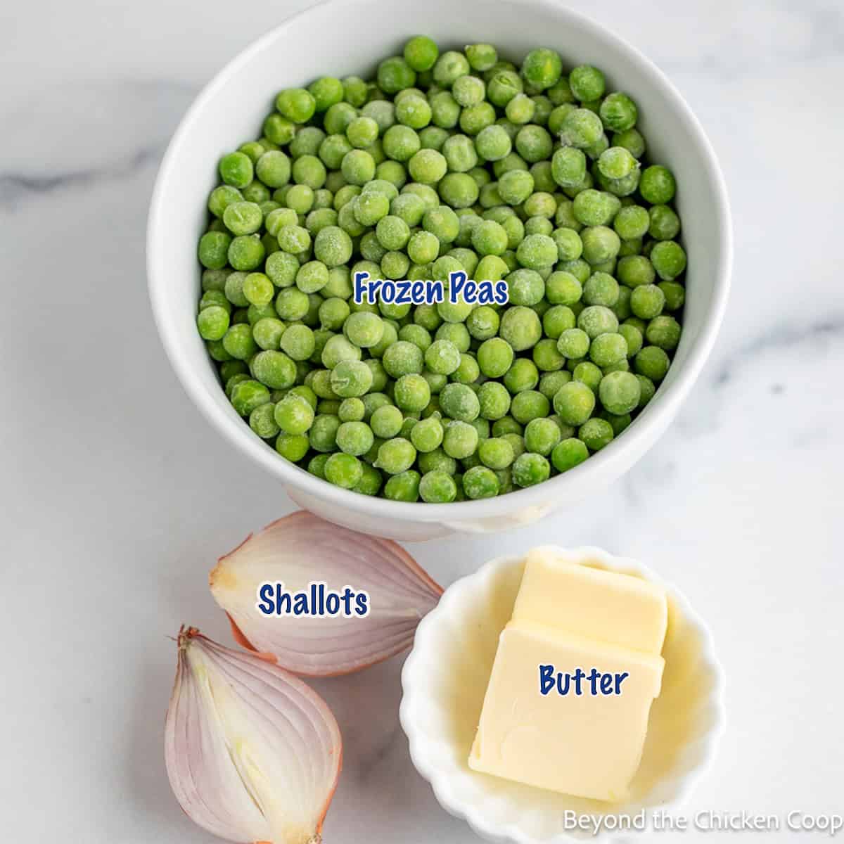 A bowl of frozen peas, shallots, and butter.
