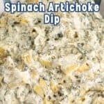 A bowl filled with a creamy dip with artichokes.