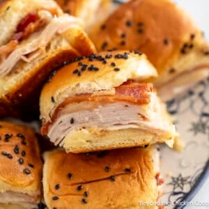 A pile of Turkey Bacon Sliders on a plate.