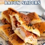Small turkey sandwiches with bacon on a plate.