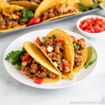 Baked Ground Turkey Tacos on a white plate.
