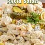 Small pasta shells with chunks of cheddar cheese and pickles.