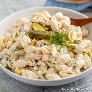 A bowl filled with Dill Pickle Pasta Salad.