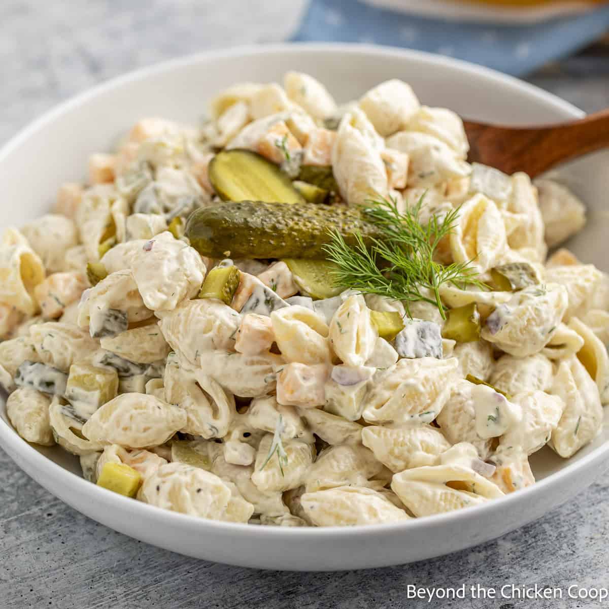 A bowl filled with Dill Pickle Pasta Salad. 
