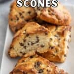 A tray filled with scones with chocolate chips.