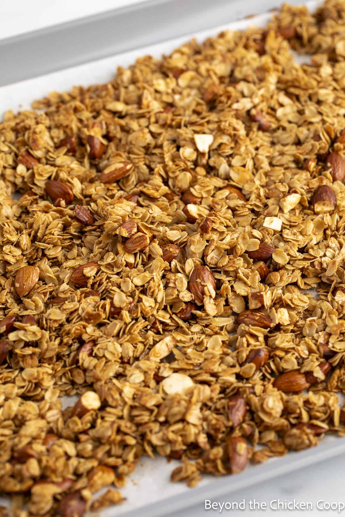 Baked granola on a baking sheet.