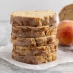 Slices of Homemade Peach Bread stacked on top of each other.