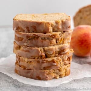 Slices of Homemade Peach Bread stacked on top of each other.