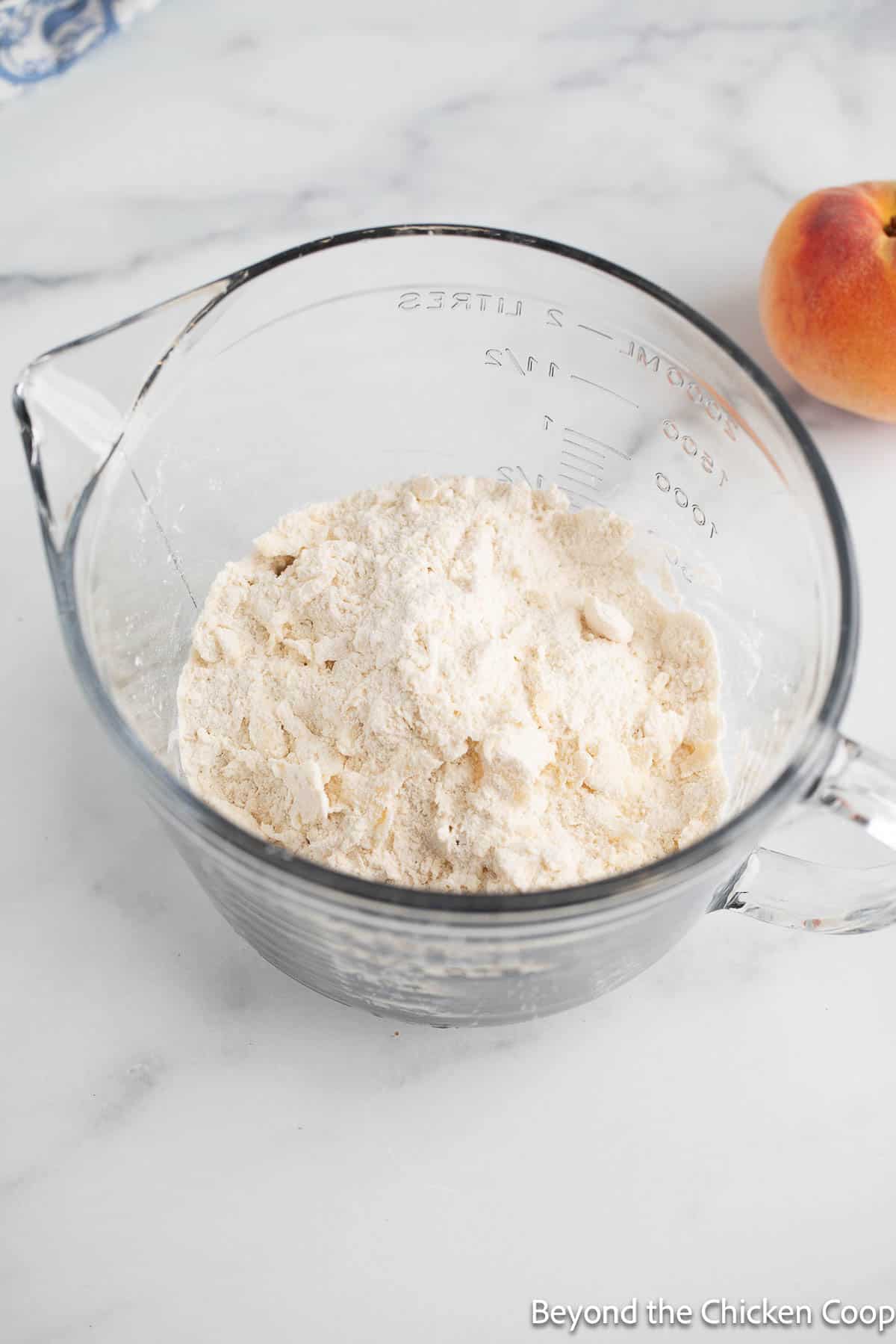 Making a cobbler topping.