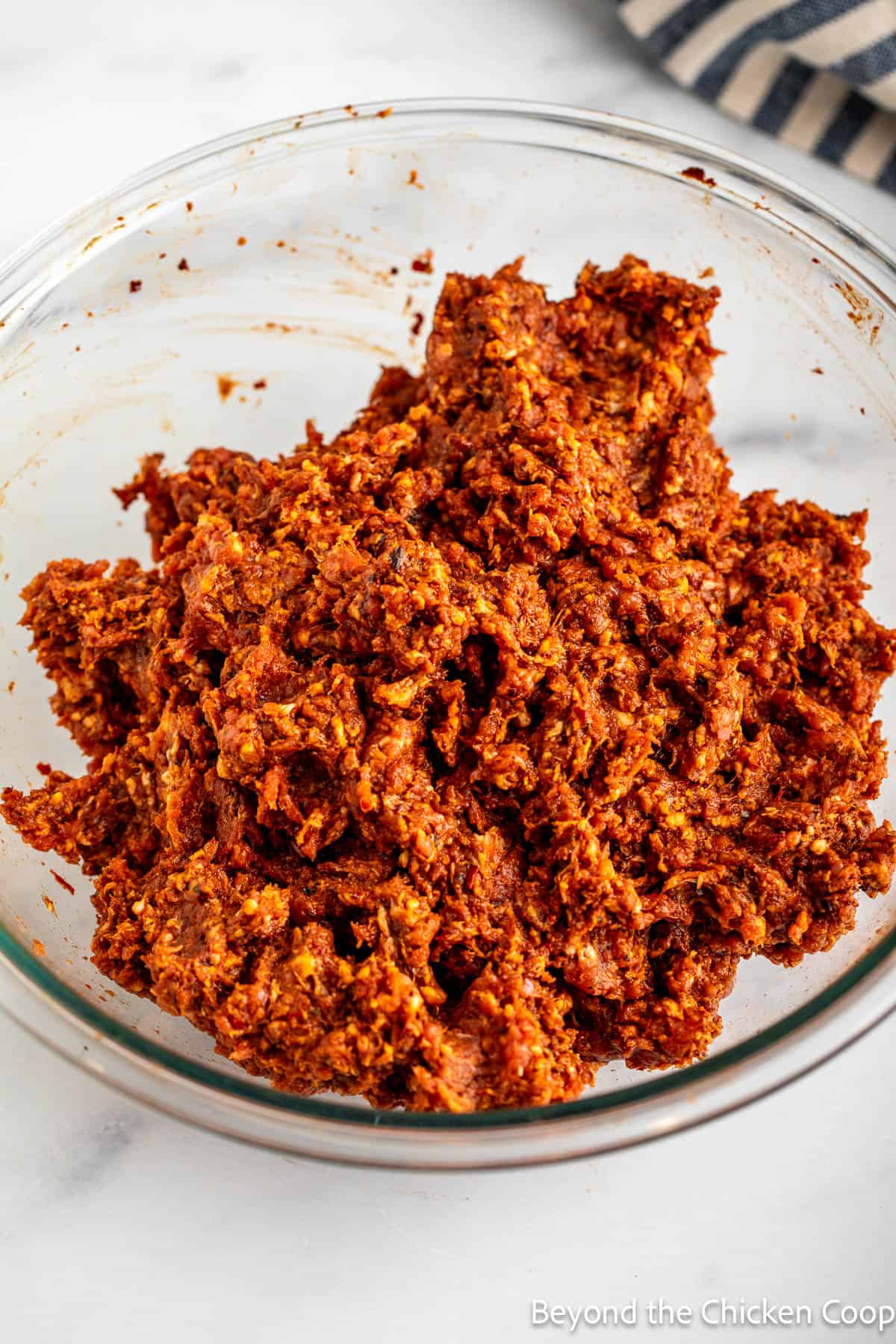 A bowl filled with raw chorizo sausage.