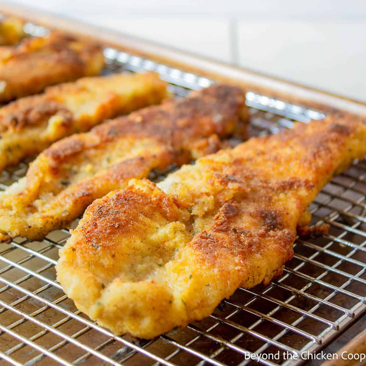 Pan Fried Fish Crispy fried fish on a baking rack.