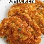 Crispy chicken cutlets topped with chopped parsley.
