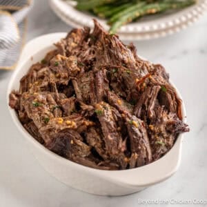 Roasted Shredded Beef in a white dish.
