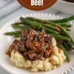 Mashed potatoes topped with shredded beef.