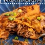 Two beef enchiladas on a blue plate.