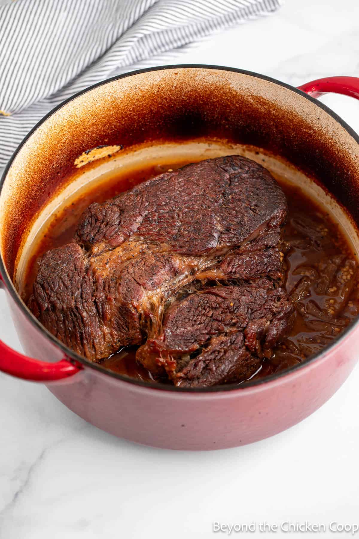 Cooked chuck roast in dutch oven.