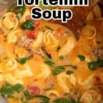 Soup with tortellini and sausage in a pot.